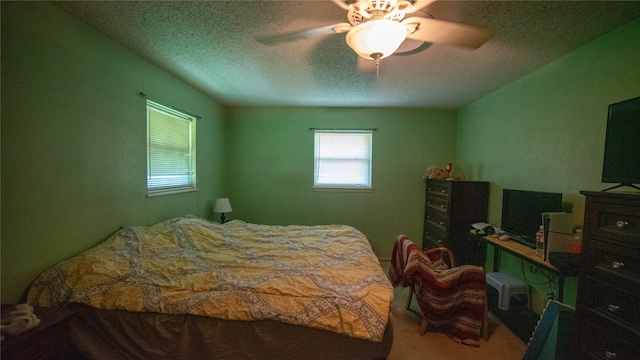 205 Mesa Dr, Gatesville, TX 76528 - carpeted bedroom with a textured ceiling and ceiling fan