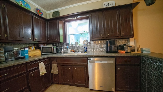 205 Mesa Dr, Gatesville, TX 76528 - kitchen with stainless steel appliances, a sink, dark brown cabinetry, ornamental molding, and backsplash