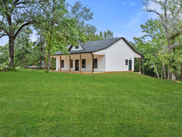 71 Prescott Dr, New Waverly, TX 77358 - rear view of house with a yard and roof with shingles