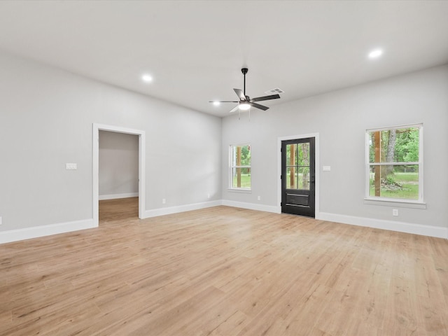 71 Prescott Dr, New Waverly, TX 77358 - unfurnished living room with ceiling fan, light wood-type flooring, baseboards, and recessed lighting
