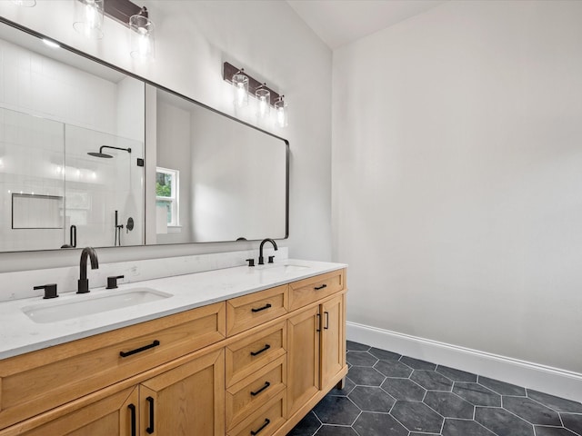 71 Prescott Dr, New Waverly, TX 77358 - bathroom with double vanity, tiled shower, tile patterned flooring, and baseboards