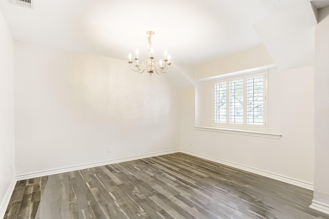5247 Ariel St, Houston, TX 77096 - empty room with a chandelier, dark wood finished floors, and baseboards