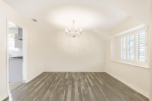 5247 Ariel St, Houston, TX 77096 - unfurnished dining area with a chandelier, wood finished floors, healthy amount of natural light, and baseboards