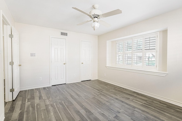 5247 Ariel St, Houston, TX 77096 - unfurnished bedroom featuring wood finished floors, baseboards, and ceiling fan