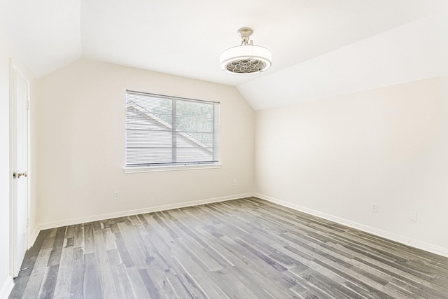 5247 Ariel St, Houston, TX 77096 - additional living space with lofted ceiling, wood finished floors, and baseboards