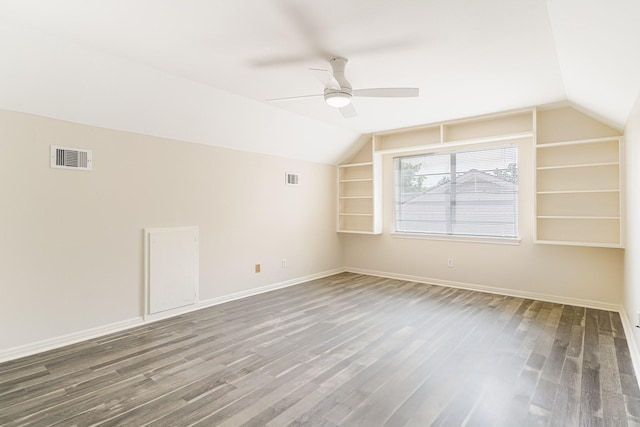 5247 Ariel St, Houston, TX 77096 - bonus room with lofted ceiling, wood finished floors, built in shelves, ceiling fan, and baseboards