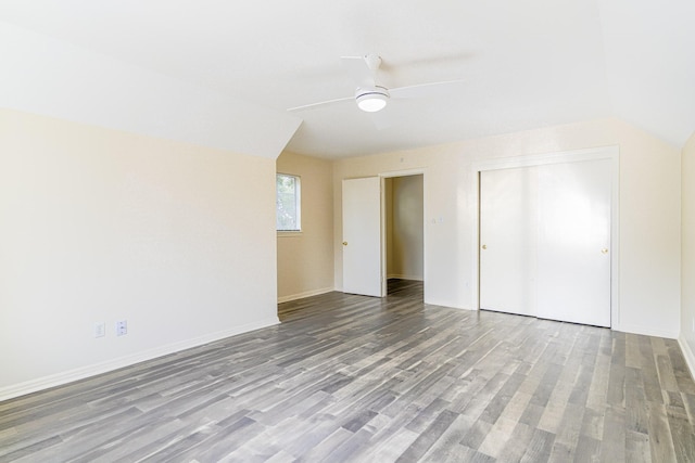 5247 Ariel St, Houston, TX 77096 - unfurnished bedroom with wood finished floors, a closet, lofted ceiling, a ceiling fan, and baseboards