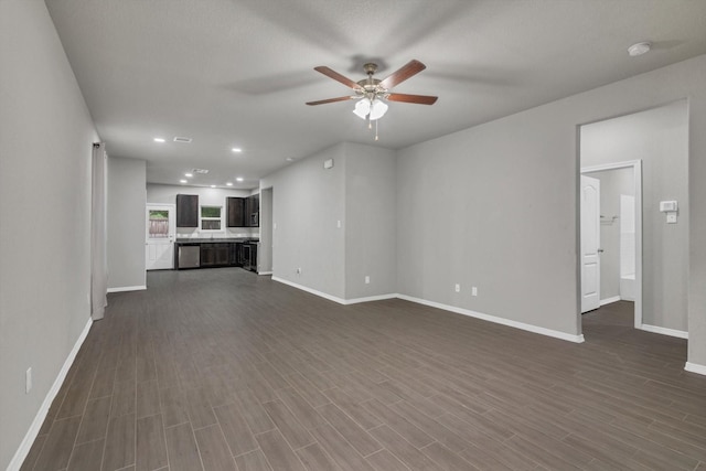 24742 Russet Bluff Trl, Houston, TX 77336 - unfurnished living room with ceiling fan, baseboards, dark wood finished floors, and recessed lighting
