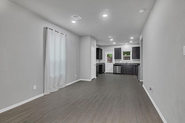 24742 Russet Bluff Trl, Houston, TX 77336 - unfurnished living room with baseboards, dark wood-style floors, and recessed lighting