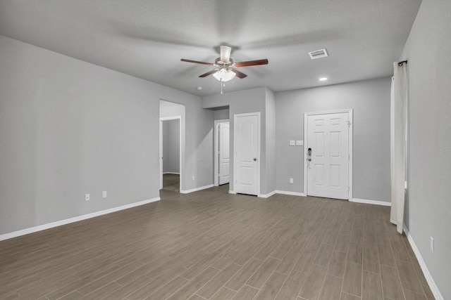 24742 Russet Bluff Trl, Houston, TX 77336 - spare room featuring a ceiling fan, wood finished floors, baseboards, and recessed lighting