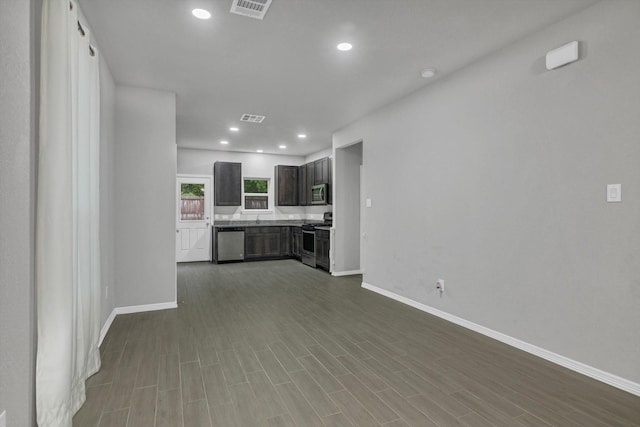 24742 Russet Bluff Trl, Houston, TX 77336 - kitchen with appliances with stainless steel finishes, baseboards, recessed lighting, a sink, and light countertops
