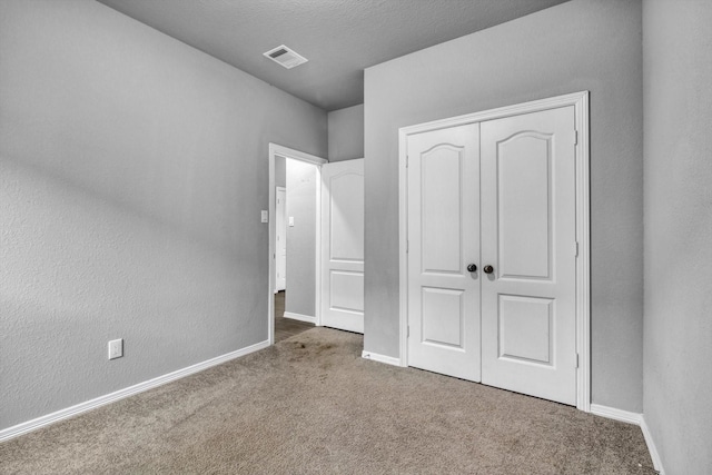 24742 Russet Bluff Trl, Houston, TX 77336 - unfurnished bedroom featuring carpet floors, a closet, and baseboards