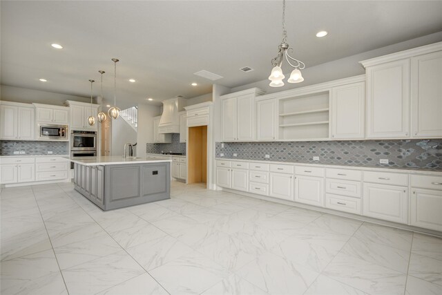 26510 Crimson Bluff Ln, Katy, TX 77494 - kitchen featuring appliances with stainless steel finishes, a sink, decorative backsplash, custom exhaust hood, and light marble finish floors