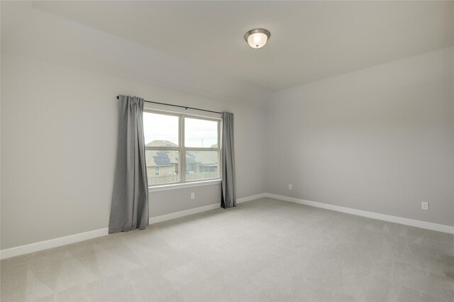 26510 Crimson Bluff Ln, Katy, TX 77494 - spare room featuring light carpet and baseboards