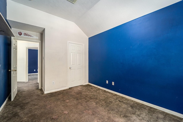 18530 S Wimbledon Dr, Katy, TX 77449 - unfurnished bedroom with vaulted ceiling, carpet flooring, and baseboards