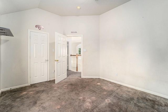 18530 S Wimbledon Dr, Katy, TX 77449 - unfurnished bedroom with vaulted ceiling, carpet, and baseboards