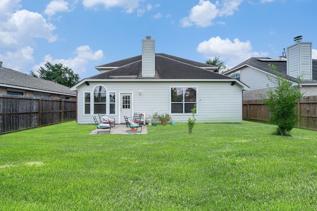 18530 S Wimbledon Dr, Katy, TX 77449 - rear view of property featuring a patio area, roof with shingles, and a chimney