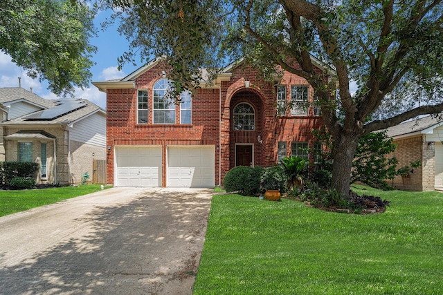 18530 S Wimbledon Dr, Katy, TX 77449 - traditional home featuring driveway, brick siding, a front yard, and a garage