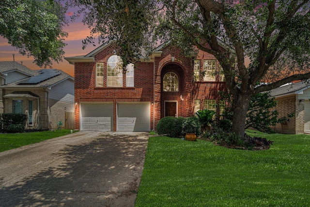18530 S Wimbledon Dr, Katy, TX 77449 - view of front of house featuring concrete driveway, brick siding, a front lawn, and a garage