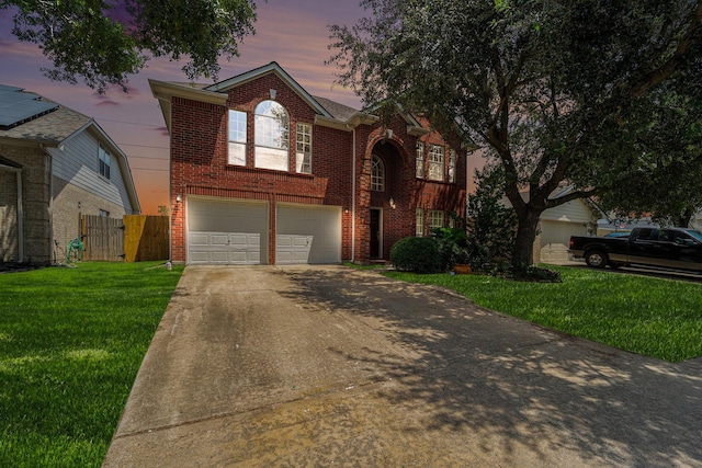 18530 S Wimbledon Dr, Katy, TX 77449 - traditional home with concrete driveway, brick siding, and an attached garage