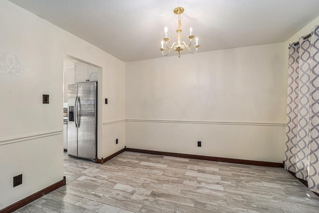 18530 S Wimbledon Dr, Katy, TX 77449 - unfurnished dining area with a chandelier and baseboards