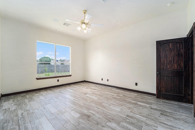 18530 S Wimbledon Dr, Katy, TX 77449 - empty room with light wood-style floors, a ceiling fan, baseboards, and a smoke detector