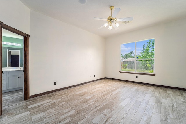 18530 S Wimbledon Dr, Katy, TX 77449 - empty room with ceiling fan, light wood finished floors, and baseboards