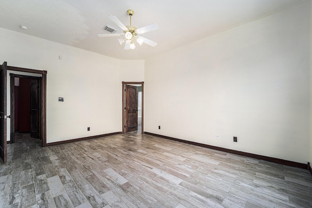 18530 S Wimbledon Dr, Katy, TX 77449 - unfurnished room with light wood-style flooring, a ceiling fan, and baseboards