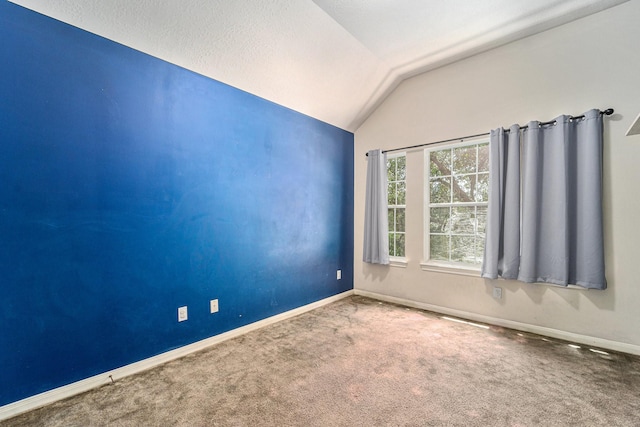 18530 S Wimbledon Dr, Katy, TX 77449 - empty room with vaulted ceiling, carpet floors, and baseboards