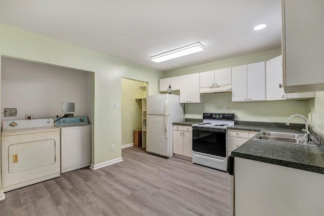 1037 Wall St, Houston, TX 77088 - kitchen featuring white appliances, a sink, under cabinet range hood, washing machine and dryer, and white cabinets
