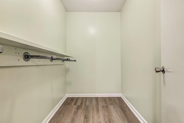 1037 Wall St, Houston, TX 77088 - walk in closet featuring wood finished floors