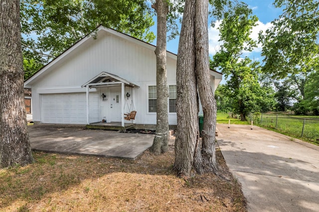 1037 Wall St, Houston, TX 77088 - view of front of property with driveway and a garage
