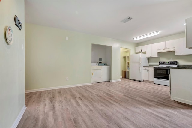 1037 Wall St, Houston, TX 77088 - kitchen with freestanding refrigerator, electric stove, dark countertops, and washer / dryer
