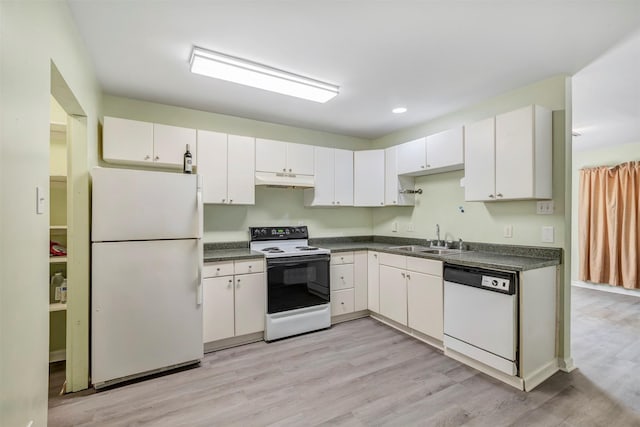 1037 Wall St, Houston, TX 77088 - kitchen with white appliances, a sink, dark countertops, light wood-style floors, and recessed lighting