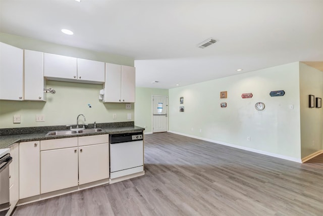1037 Wall St, Houston, TX 77088 - kitchen featuring dishwasher, a sink, light wood-type flooring, dark countertops, and baseboards