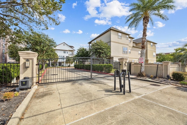 18731 Egret Oaks Ln, Webster, TX 77058 - gate featuring a residential view