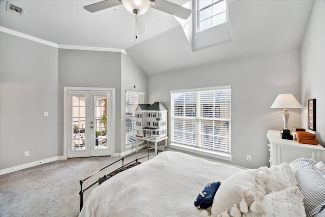 18731 Egret Oaks Ln, Webster, TX 77058 - bedroom with access to exterior, baseboards, multiple windows, lofted ceiling, and carpet
