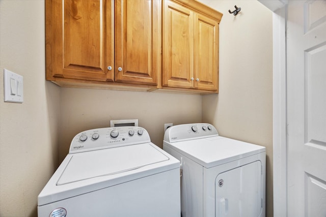 18731 Egret Oaks Ln, Webster, TX 77058 - laundry area featuring washing machine and clothes dryer and cabinet space
