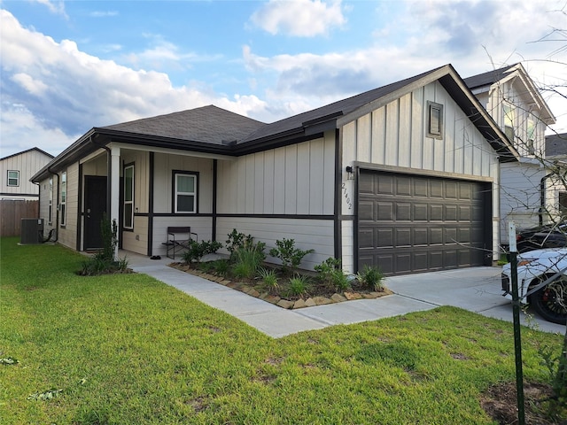 21402 Rising Fawn Rd, Porter, TX 77365 - view of front of property with board and batten siding, central air condition unit, an attached garage, and driveway