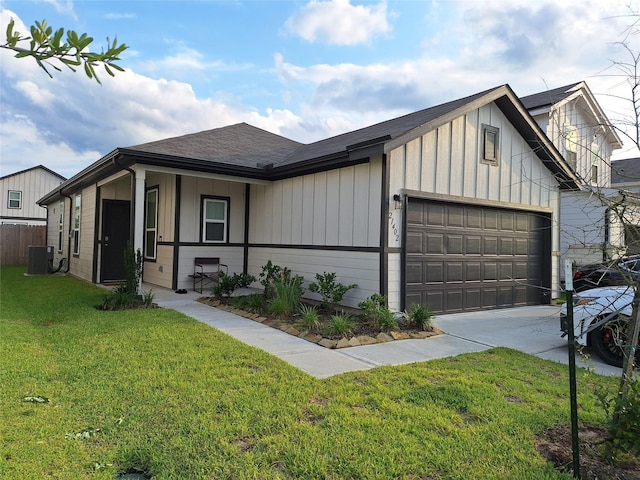 21402 Rising Fawn Rd, Porter, TX 77365 - view of front of house featuring cooling unit, board and batten siding, an attached garage, driveway, and a front lawn