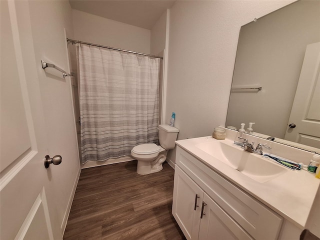 21402 Rising Fawn Rd, Porter, TX 77365 - full bath with vanity, wood finished floors, and toilet