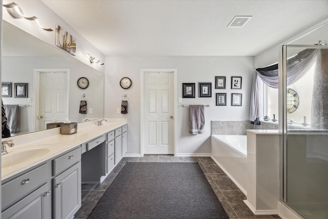18719 Cypress Lake Village Dr, Cypress, TX 77429 - full bath with double vanity, a bath, a stall shower, and tile patterned flooring