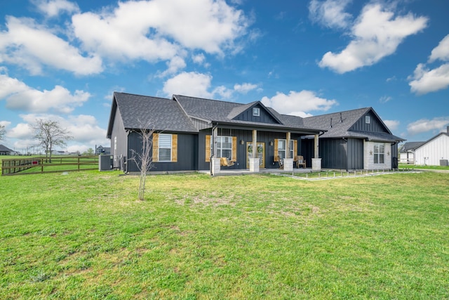 5315 Hammond Cir, Iola, TX 77861 - view of front of house featuring board and batten siding, central air condition unit, and roof with shingles