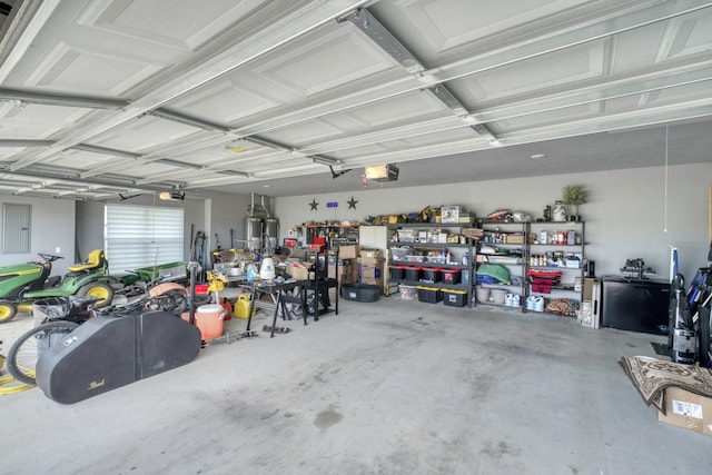 5315 Hammond Cir, Iola, TX 77861 - garage with a garage door opener, a workshop area, and electric panel