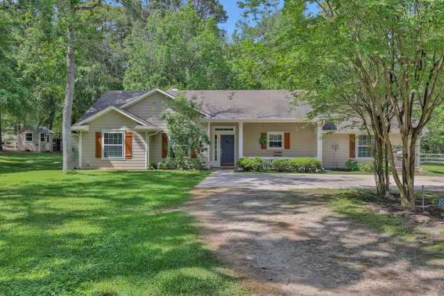 24240 Oak Hollow Blvd, Hockley, TX 77447 - ranch-style home with driveway, covered porch, and a shingled roof