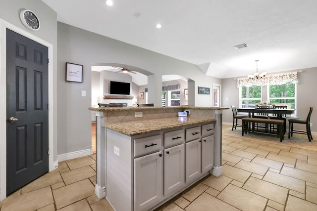 24240 Oak Hollow Blvd, Hockley, TX 77447 - kitchen featuring arched walkways, baseboards, a chandelier, and recessed lighting