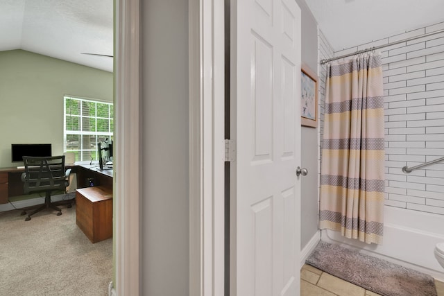 24240 Oak Hollow Blvd, Hockley, TX 77447 - bathroom with shower / bathtub combination with curtain and vaulted ceiling
