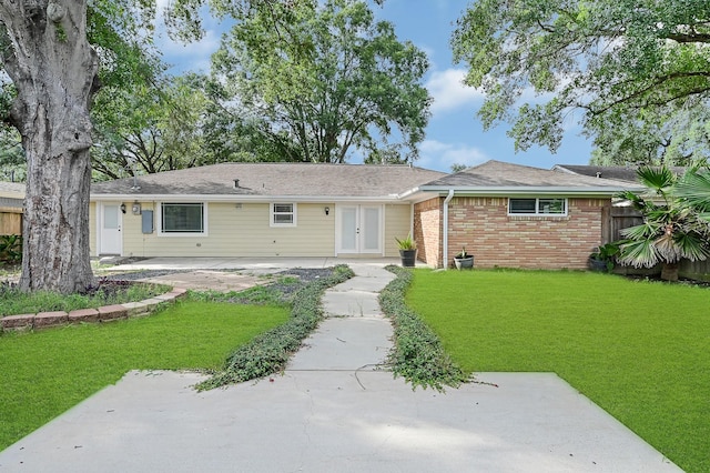 5623 Cerritos Dr, Houston, TX 77035 - ranch-style home with french doors, a patio, and brick siding