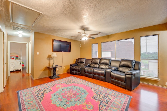 4406 Hidden Trace Ct, Houston, TX 77066 - living area with attic access, wood finished floors, ceiling fan, a textured ceiling, and baseboards