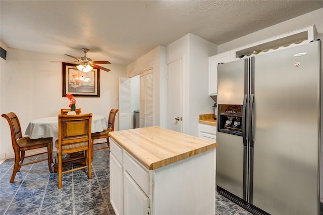 4406 Hidden Trace Ct, Houston, TX 77066 - kitchen with stainless steel refrigerator with ice dispenser, wooden counters, white cabinetry, a ceiling fan, and a center island